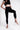 Soft Recycled Leggings With Pockets - Black on model with 1 leg up