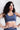 Soft Recycled Sports Bra - Blue on model with hands on hips