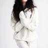 Organic hoody - White on model with arms crossed