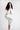 Organic hoody - White on model with hands clasped and leg raised