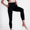 Soft Recycled Leggings With Pockets - Black on model with 1 leg up