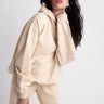 Organic Hoody - Sand on model with hand on neck