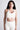 Soft Recycled Sports Bra - Oatmeal on model with shorts