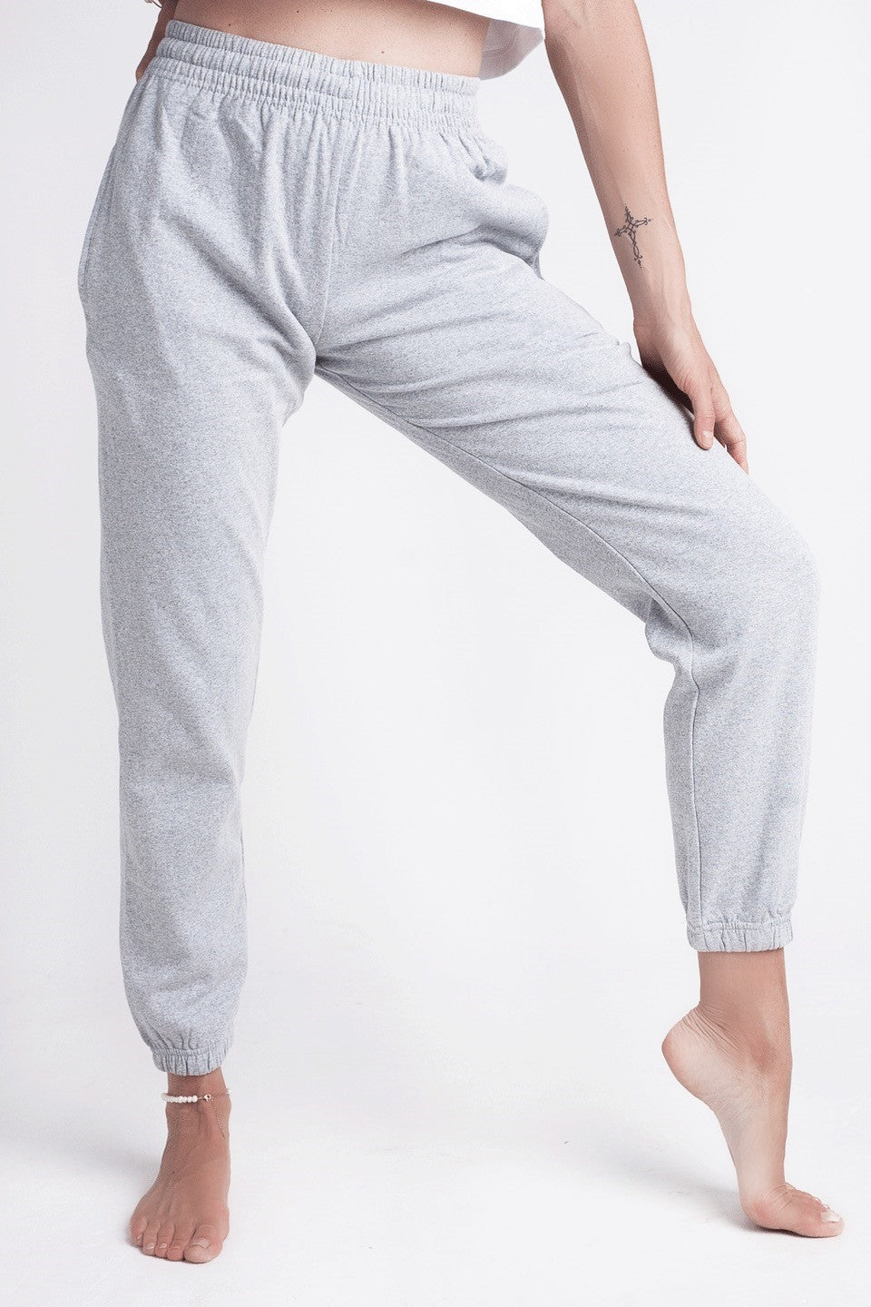 Recycled Cotton Drawstring Joggers - Grey on model with hand on knee