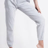 Recycled Cotton Drawstring Joggers - Grey on model with hand on knee